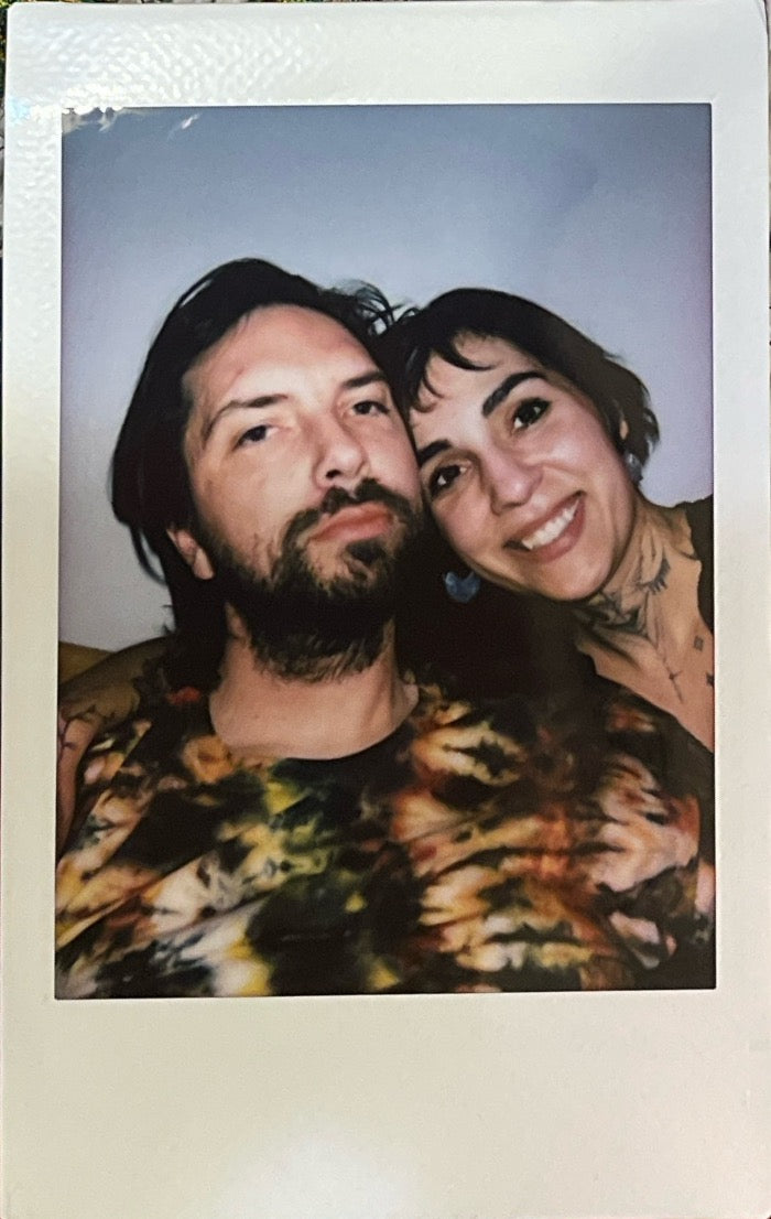 "Front view portrait of Jacob and Melissa, owners of Bunney Mart, crafting unique handmade and pop culture shirts."